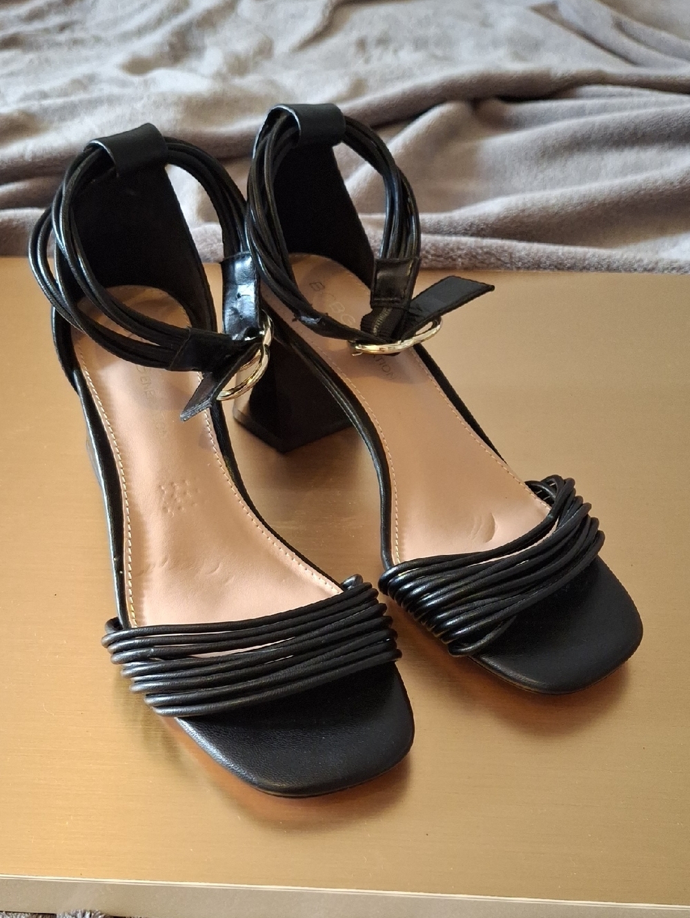 BCBGeneration Black Strappy Heels with Gold Accents